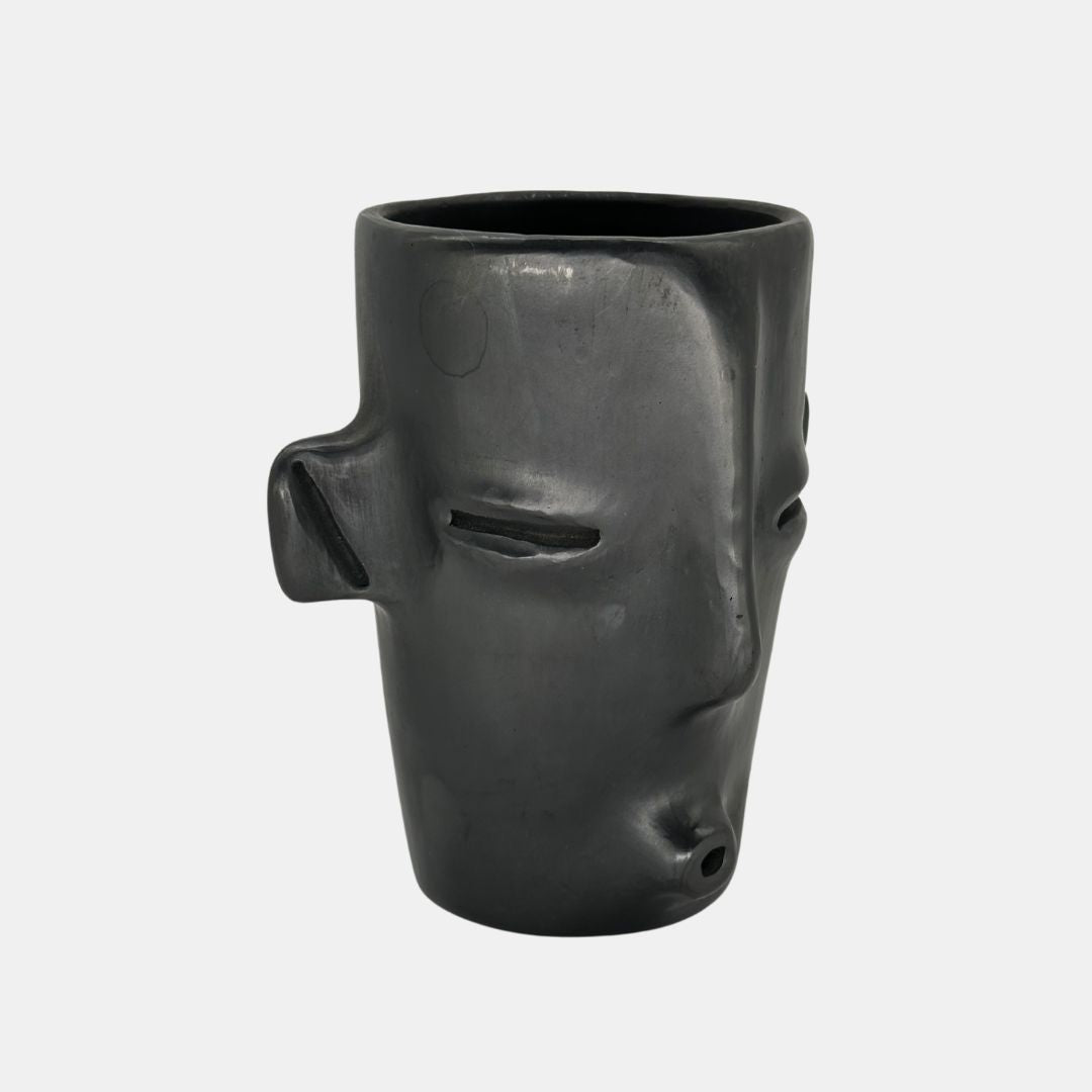 Face whistling with ears vase